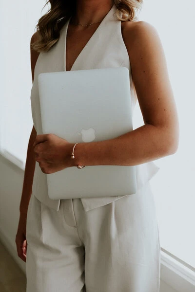 Holding laptop Holding onto laptop